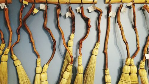 Brooms hanging on wall