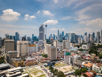 Aerial view of cityscape against sky