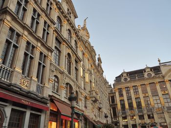 Low angle view of buildings against clear sky