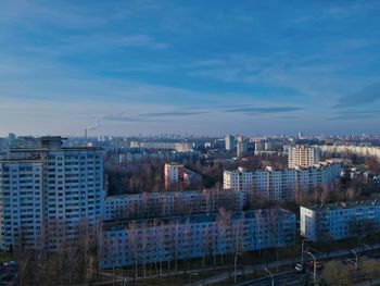 High angle view of buildings in city against sky