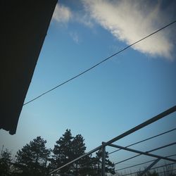 Low angle view of cables against sky