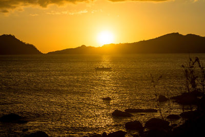 Scenic view of sea against sky during sunset