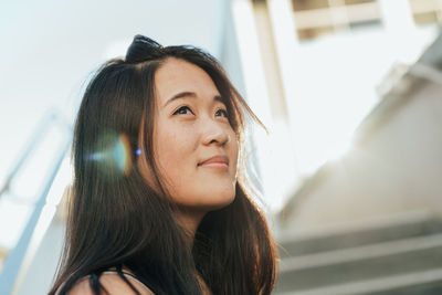 Portrait of young woman looking away