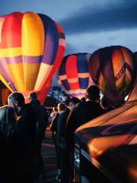 People watching hot air balloons