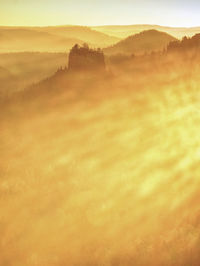 Scenic view of landscape against sky during sunset