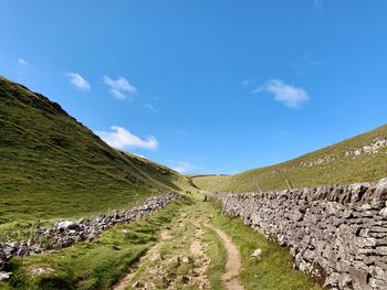 Panoramic view of landscape against blue sky