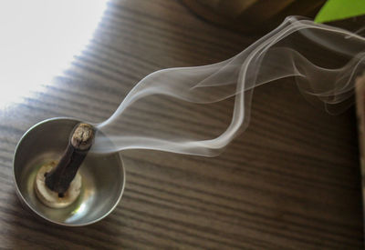 High angle view of coffee cup on table