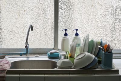 Kitchen sink against window at home