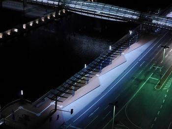 High angle view of illuminated buildings in city at night