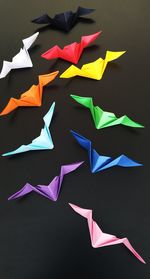 High angle view of multi colored umbrellas hanging on paper