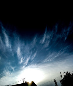 Low angle view of silhouette trees against sky during sunset