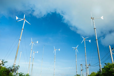 Wind turbine for alternative energy on blue sky for background.