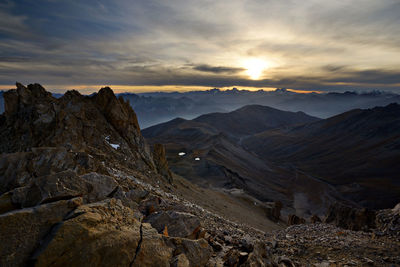 Scenic view of mountains against sky during sunset