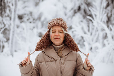 Portrait of a young girl in the winter forest