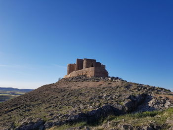 Low angle view of fort against blue sky