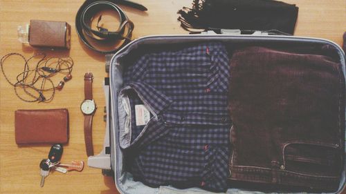 Close-up of people sitting on wall