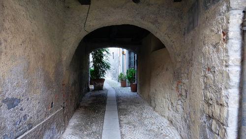 Narrow corridor along old building