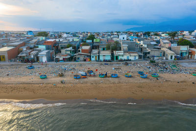 Panoramic view of beach and buildings against sky