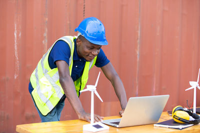 Full length of man working on table