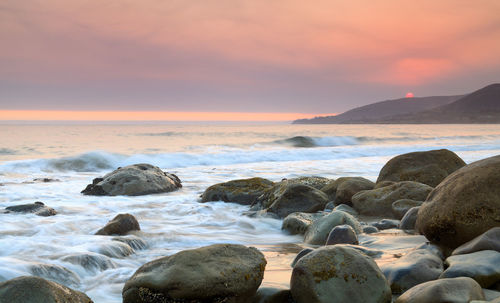 Scenic view of sea against sky during sunset