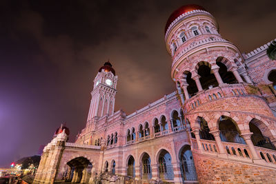 Low angle view of historical building at night