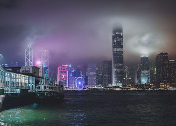 Buildings in city at dusk