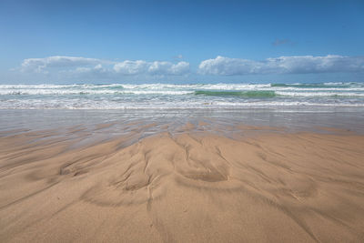 Scenic view of beach against sky