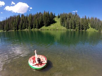 High angle view of girl in inflatable ring on lake