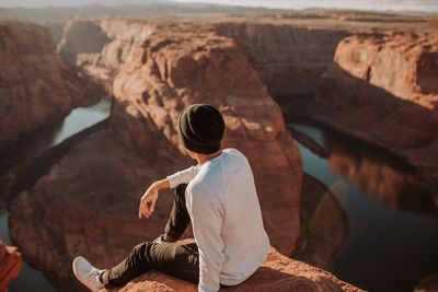 Man sitting on rock