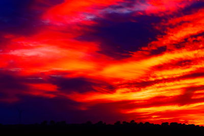 Scenic view of dramatic sky during sunset