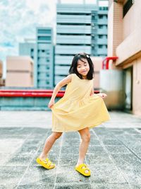 Portrait of young woman cute girl standing in city