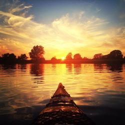 Scenic view of lake at sunset