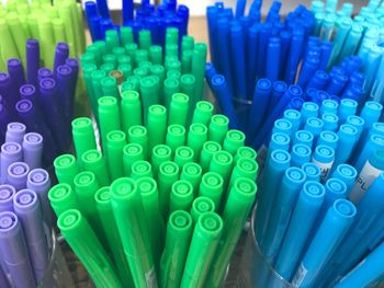 High angle view of multi colored pencils in container