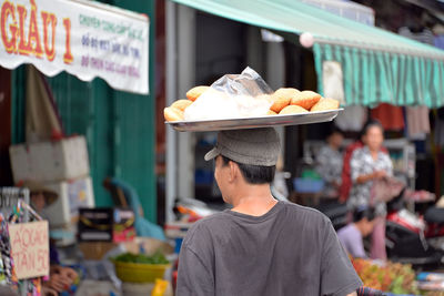 Man preparing food at market stall