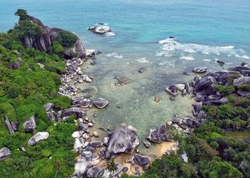 High angle view of rocks in sea