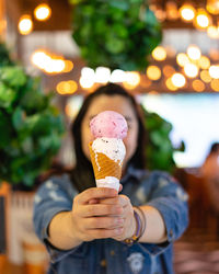 Woman holding ice cream cone