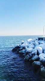 Scenic view of sea against clear blue sky