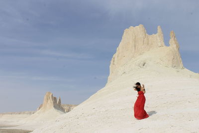 Woman standing at desert