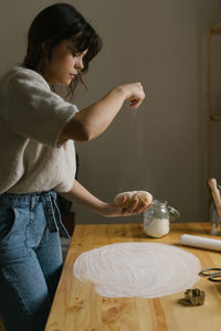 Young woman making christmas cookies