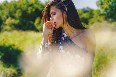 Young woman looking away outdoors