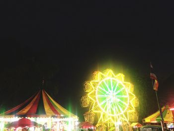 Illuminated christmas lights in city at night