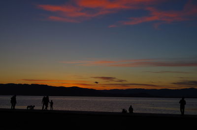 Silhouette people at sunset