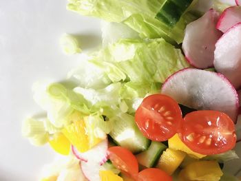 Close-up of chopped fruits in plate