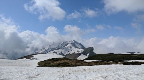 Scenic view of snowcapped mountain against sky