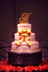 Wedding cake against wall