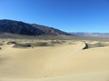 Scenic view of desert against clear sky