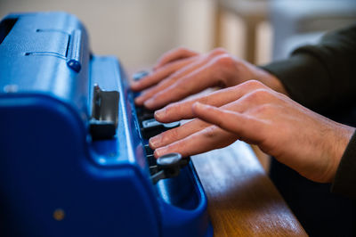 Midsection of man playing piano