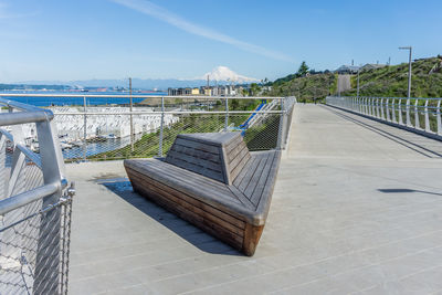 A walking bridge and mount rainier in ruston, washington.