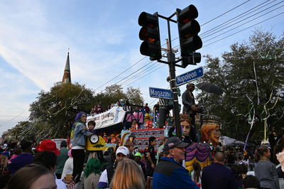 People on street in city against sky