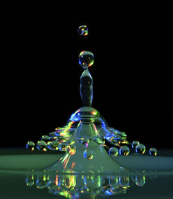 Close-up of bubbles against black background